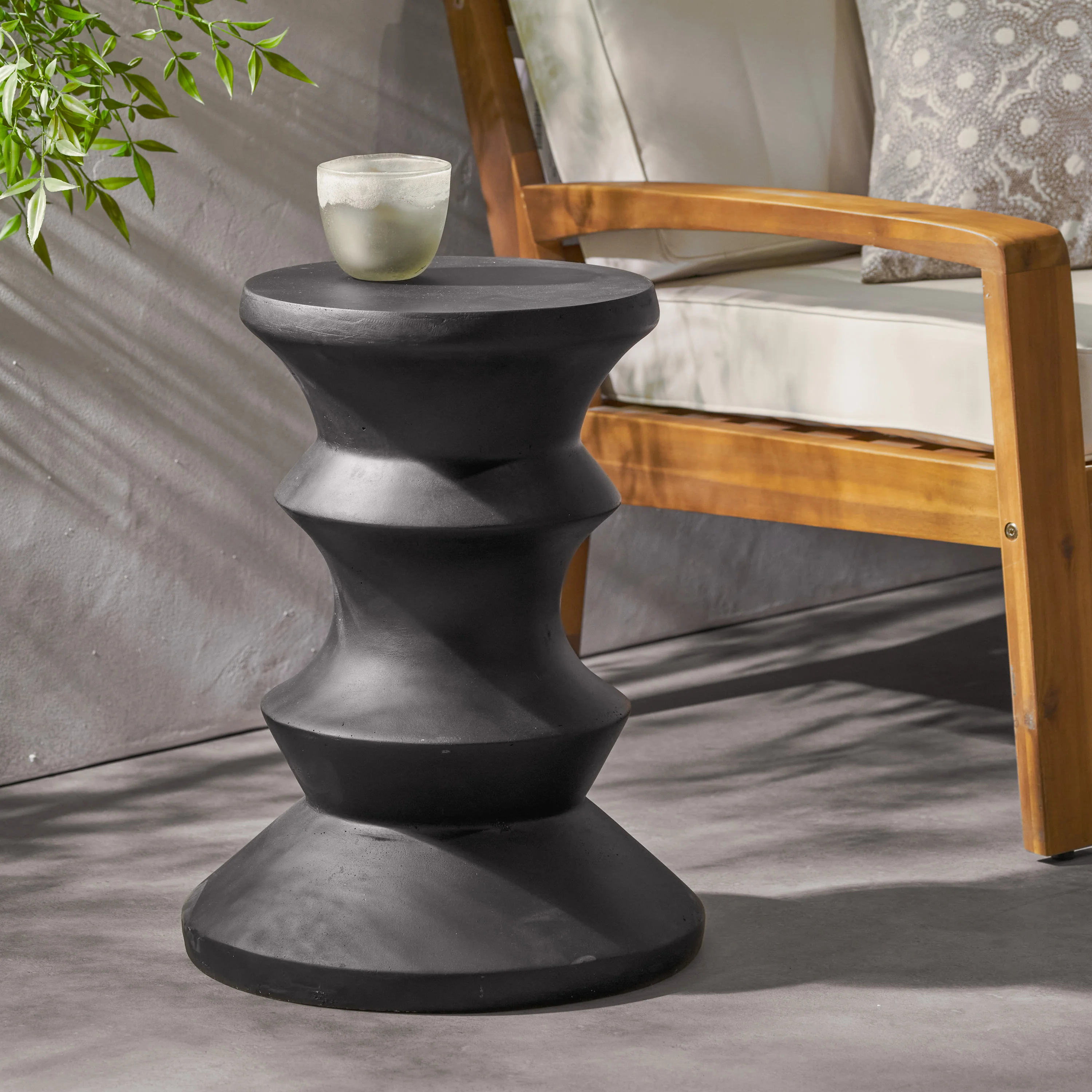 Outdoor End Table with Sculptural Design and Round Table Top - Image 9